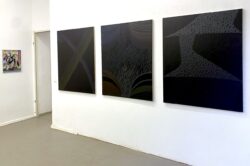 abstract paintings in a white cube art space